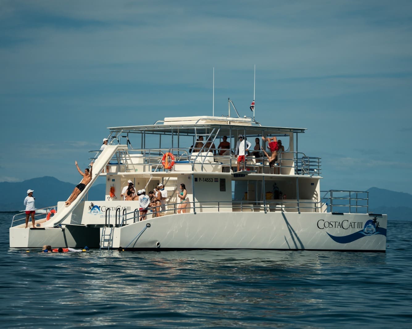 Sunset cruise in Costa Rica with glowing sky and calm water