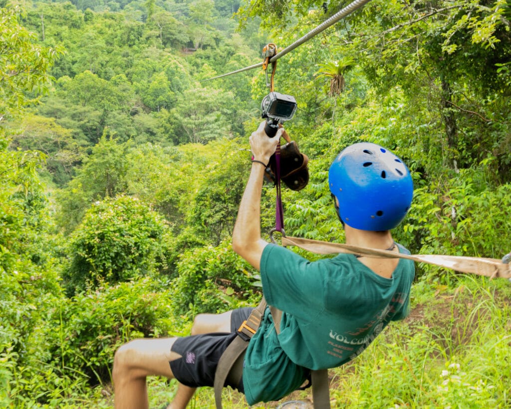 Tourist ziplining in Jaco, Costa Rica on a guided adventure tour